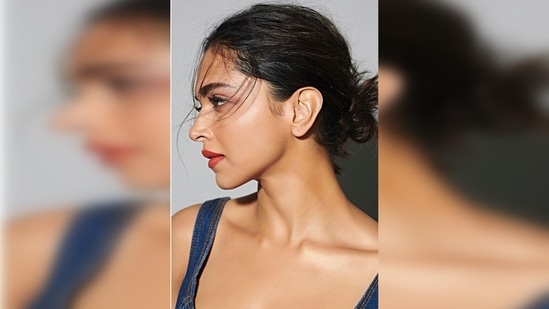Deepika Padukone tied her hair in a messy bun with untamed strands flowing in the direction of the wind.(Instagram/@yiannitsapatori)