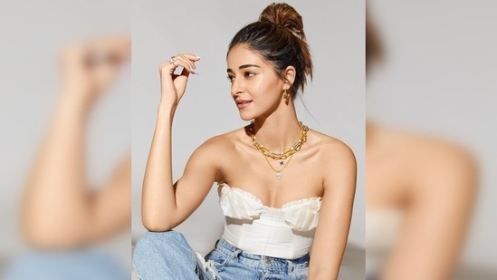 Ananya Panday accessorised her outfit with multi-layered gold and silver necklace and small gold hoop earrings.(Instagram/@ananyapanday)