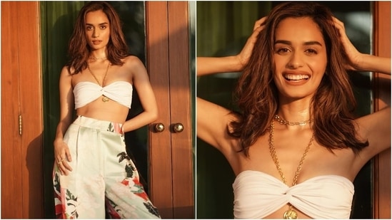 Manushi flaunts her toned midriff in bikini top and floral pants.&nbsp;