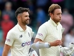 England's James Anderson and Stuart Broad leave the field after forcing a draw on day 5.