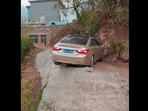 The image, taken from the viral Facebook video, shows the car on a narrow road.