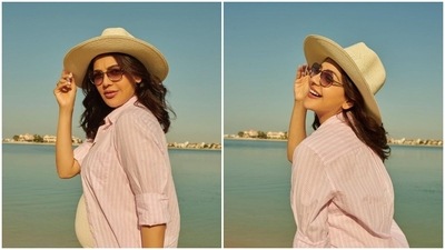 Kajal Aggarwal, who is expecting her first child, is currently vacationing in Dubai. The actor has been sharing some beautiful pictures of herself flaunting her baby bump. In her recent set of photos, Kajal can be seen posing in a pink bodycon dress and striped oversized shirt. (Instagram/@kajalaggarwalofficial) Kajal Aggarwal, who is expecting her first child, is currently vacationing in Dubai. The actor has been sharing some beautiful pictures of herself flaunting her baby bump. In her recent set of photos, Kajal can be seen posing in a pink bodycon dress and striped oversized shirt. (Instagram/@kajalaggarwalofficial)