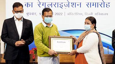 Delhi chief minister Arvind Kejriwal handing over a certificate confirming employment to an employee during the regularisation of 700 contractual Delhi Jal Board employees at an event held at the Delhi Secretariat in New Delhi on Wednesday. (ANI) Delhi chief minister Arvind Kejriwal handing over a certificate confirming employment to an employee during the regularisation of 700 contractual Delhi Jal Board employees at an event held at the Delhi Secretariat in New Delhi on Wednesday. (ANI)