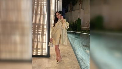 Nora Fatehi teamed her look with a pair of golden stilettoes and a small purse. (Instagram/@norafatehi) Nora Fatehi teamed her look with a pair of golden stilettoes and a small purse. (Instagram/@norafatehi)