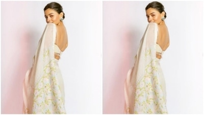 Alia decked up in an ivory white saree embroidered in golden resham threads. She teamed it with a strappy white blouse with white tassels in the back. (Instagram/@aliabhatt)