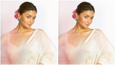 In blush pink eyeshadow, black eyeliner, mascara-laden eyelashes, contoured cheeks, nude lipstick and a small black bindi, Alia added more ethnic vibes to her look in a clean bun (Instagram/@aliabhatt)
