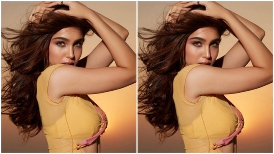 Matching the colour of her backdrop in the bikini, Sharvari accessorised her look with a minimalistic silver neck chain and a pendant.(Instagram/@sharvari)