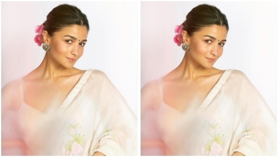 In blush pink eyeshadow, black eyeliner, mascara-laden eyelashes, contoured cheeks, nude lipstick and a small black bindi, Alia added more ethnic vibes to her look in a clean bun(Instagram/@aliabhatt)