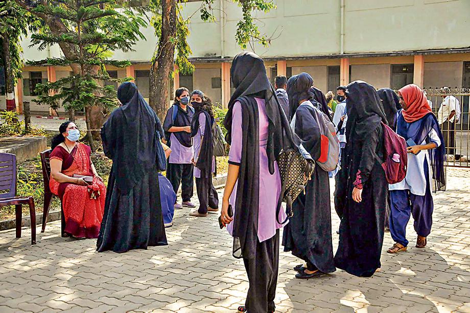 Students wearing 'hijab' who were denied entry at IDSG Government College in Chikmagalur, on Tuesday, February 8, 2022. (PTI Photo) Students wearing 'hijab' who were denied entry at IDSG Government College in Chikmagalur, on Tuesday, February 8, 2022. (PTI Photo)