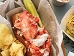 This image released by Goldbelly shows a lobster roll from McLoons Lobster Shack in Maine. This image released by Goldbelly shows a lobster roll from McLoons Lobster Shack in Maine. 
