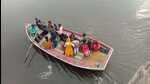 In Bah assembly area of Agra, villagers cross River Yamuna to cast their votes, on Thursday. (HT Photo)