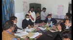 A returning officer busy in scrutiny of nomination papers in Prayagraj on Wednesday. (HT photo)