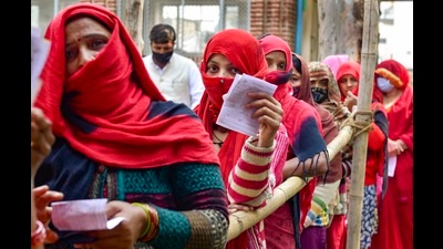 Women stand in a queue to cast their votes, during the first phase of UP polls, at a polling station at Vaidpura village, in Gautam Buddha Nagar on Thursday. (PTI) Women stand in a queue to cast their votes, during the first phase of UP polls, at a polling station at Vaidpura village, in Gautam Buddha Nagar on Thursday. (PTI)