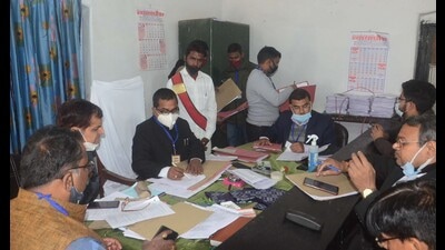 A returning officer busy in scrutiny of nomination papers in Prayagraj on Wednesday. (HT photo) A returning officer busy in scrutiny of nomination papers in Prayagraj on Wednesday. (HT photo)