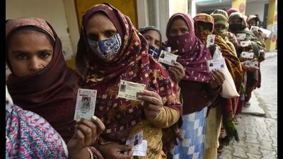 People queue up to cast their vote in the assembly elections, at Usman Colony in Ghaziabad on Thursday. (Sakib Ali /HT) People queue up to cast their vote in the assembly elections, at Usman Colony in Ghaziabad on Thursday. (Sakib Ali /HT)