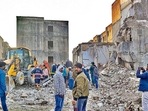 Rescue work in progress after a portion of a building collapsed in a JJ Colony at Bawana, in New Delhi, Friday, Feb 11, 2022. Several people are feared to be trapped in the debris. (PTI Photo) Rescue work in progress after a portion of a building collapsed in a JJ Colony at Bawana, in New Delhi, Friday, Feb 11, 2022. Several people are feared to be trapped in the debris. (PTI Photo)