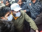 Bhupinder Singh Honey, nephew of Punjab CM Charanjit Singh Channi, being brought to court by ED officials in Jalandhar on Friday.(PTI)