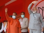 Uttar Pradesh chief minister Yogi Adityanath, left, and Prime Minister Narendra Modi wave towards the crowd during an election rally in Kasganj, India, Friday, February 11, 2022. (AP Photo/Rajesh Kumar Singh) Uttar Pradesh chief minister Yogi Adityanath, left, and Prime Minister Narendra Modi wave towards the crowd during an election rally in Kasganj, India, Friday, February 11, 2022. (AP Photo/Rajesh Kumar Singh)