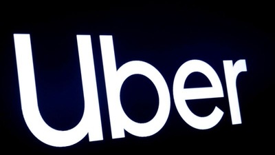 A screen displays the company logo for Uber Technologies Inc at the New York Stock Exchange (NYSE) in New York. (REUTERS)