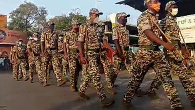 Police during a flag march, in Udupi on Friday. (ANI) Police during a flag march, in Udupi on Friday. (ANI)