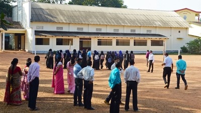 Schools and colleges will reopen from Monday but students are not allowed to wear any religious dress, the Karnataka high court said.&nbsp; (AFP)