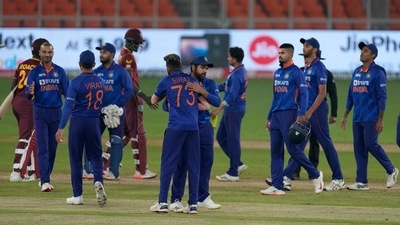 Indian players greet each other after their win in the third one-day international cricket match against West Indies (AP)