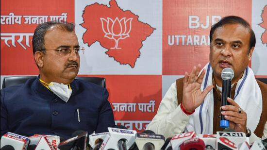 Assam CM and BJP leader Himanta Biswa Sarma with party leader and Bihar minister Mangal Pandey at a press conference, ahead of assembly polls, in Dehradun on Friday. (PTI PHOTO.)