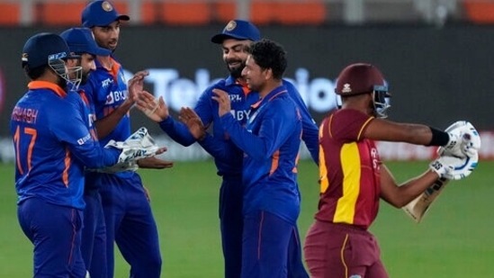 India's Kuldeep Yadav, second right, celebrates with teammates the dismissal of West Indies' captain Nicholas Pooran, right, during the third one day international cricket match between India and West Indies in Ahmedabad, India, Friday, Feb. 11, 2022. (AP Photo/Ajit Solanki)(AP)