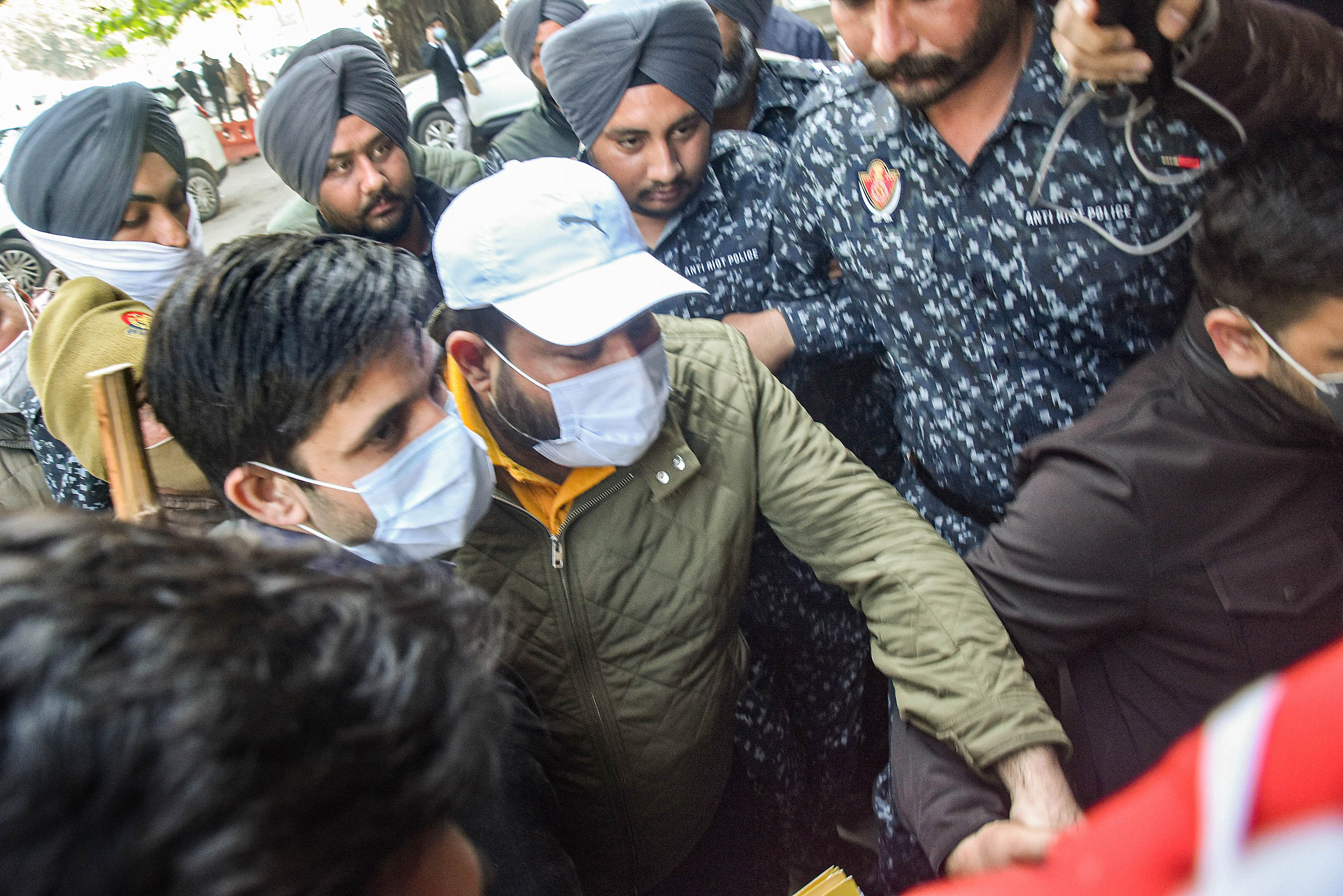 Bhupinder Singh Honey, nephew of Punjab CM Charanjit Singh Channi, being brought to court by ED officials in Jalandhar on Friday. (PTI)