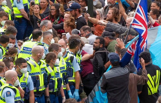 Police arrest people protesting against coronavirus mandates at Parliament in Wellington, New Zealand, Thursday, Feb. 10, 2022. (via AP) Police arrest people protesting against coronavirus mandates at Parliament in Wellington, New Zealand, Thursday, Feb. 10, 2022. (via AP)