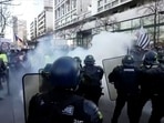 French police use teargas while facing demonstrators in this screen grab taken from a video during a "Convoi de la liberte" (The Freedom Convoy), a vehicular convoy to protest coronavirus disease (Covid-19) vaccine and restrictions in Paris, France, on February 12, 2022. (REUTERS via Reuters TV)