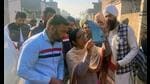 Aam Aadmi Party candidate Dr Baljit Kaur checking an X-ray during an election campaign in Malout on Saturday, (Sanjeev Kumar/HT)