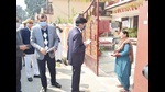 Kheri DM Mahendra Bahadur Singh alongwith CDO Anil Singh making door-to-door contact to boost polling percentage in Kheri on Saturday. (HT Photo)