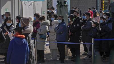 Residents wearing masks line up to get a throat swab for Covid-19 test at a hospital in Beijing. China has given conditional approval for Pfizer’s oral drug Paxlovid to treat adults with mild to moderate infection but with a high risk of developing severe disease. (AP) Residents wearing masks line up to get a throat swab for Covid-19 test at a hospital in Beijing. China has given conditional approval for Pfizer’s oral drug Paxlovid to treat adults with mild to moderate infection but with a high risk of developing severe disease. (AP)