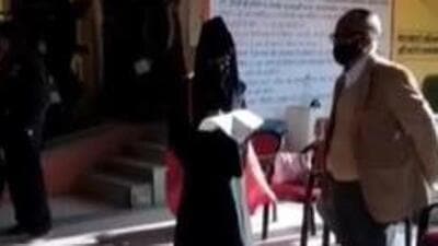 The issue of a Muslim girl being forced to write an apology for wearing hijab and burqa in a Satna college came to light on Friday evening when the video of the incident went viral on social media. (Video grab) The issue of a Muslim girl being forced to write an apology for wearing hijab and burqa in a Satna college came to light on Friday evening when the video of the incident went viral on social media. (Video grab)