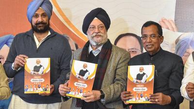Punjab elections: Union minister Hardeep Singh Puri and others release BJP manifesto promising 75% job quota to Punjab youth and other sops in Jalandhar on Saturday. (PTI) Punjab elections: Union minister Hardeep Singh Puri and others release BJP manifesto promising 75% job quota to Punjab youth and other sops in Jalandhar on Saturday. (PTI)