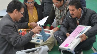 Election officials examine Electronic Voting Machines (EVM) from a distribution centre, 2017 (AFP) Election officials examine Electronic Voting Machines (EVM) from a distribution centre, 2017 (AFP)