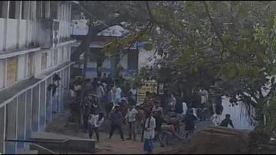 Late on Saturday evening police managed to rescue the teachers and headmaster of the Murshidabad school, who were locked up inside the school, amid stone pelting by villagers. (SCREENGRAB.) Late on Saturday evening police managed to rescue the teachers and headmaster of the Murshidabad school, who were locked up inside the school, amid stone pelting by villagers. (SCREENGRAB.)