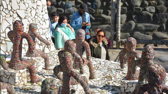 Visitors at Rock Garden, Chandigarh, amid sunny weather on Saturday. (Sant Arora/HT)