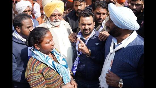 AAP candidate Kulwant Singh meeting voters in Mohali on Saturday. (HT Photo)