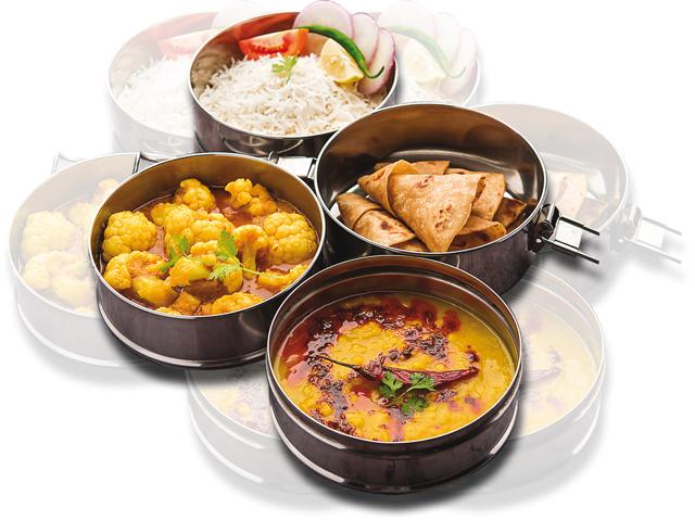 The practice of wives sending full tiffins of lunch to their husbands to eat at the office is much less prevalent than it used to be The practice of wives sending full tiffins of lunch to their husbands to eat at the office is much less prevalent than it used to be