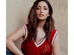 Valentine's Day is just around the corner and if you don't want to go the ideal date way - all elegant and fancy, take fashion inspiration from Bollywood actor Yami Gautam to slay a low-key and chill look in a red cut sleeves pullover with a pair of blue denim jeans. (Instagram/yamigautam)