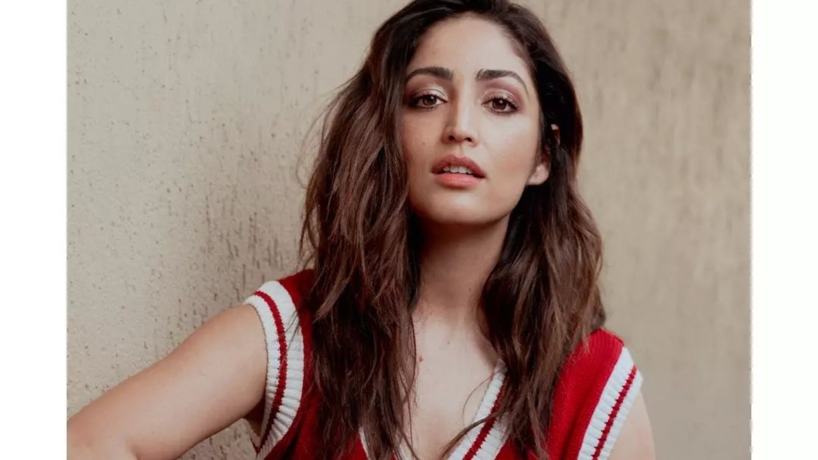 Yami Gautam gives sweater weather a sexy spin in red cut sleeves pullover, jeans Hindustan Times
