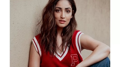 The short red pullover was teamed with a pair of dark blue denim jeans. Yami completed the attire with a pair of black sneakers to ace the smart sporty look. (Instagram/yamigautam) The short red pullover was teamed with a pair of dark blue denim jeans. Yami completed the attire with a pair of black sneakers to ace the smart sporty look. (Instagram/yamigautam)