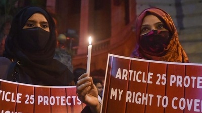 Muslim women protest against the hijab ban in Karnataka educational institutes, in Kolkata on Friday, February 11, 2022. (PTI)