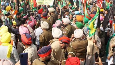 Police personnel stop farmers during a protest against Union home minister Amit Shah’s visit, in Patiala on Sunday. (ANI Photo)