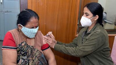 A beneficiary reacts while receiving a dose of Covid-19 vaccine during a vaccination drive, at Shiv Mandir near Jai Narayan Vyas Colony, in Bikaner. (ANI Photo) (Dinesh Gupta) A beneficiary reacts while receiving a dose of Covid-19 vaccine during a vaccination drive, at Shiv Mandir near Jai Narayan Vyas Colony, in Bikaner. (ANI Photo) (Dinesh Gupta)