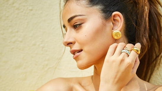 Pulling back her luscious tresses into a high ponytail hairstyle, Ananya accessorised her look with a pair of golden earrings and a stack of finger rings from Viange and Misho respectively.&nbsp;(Instagram/ananyapanday )