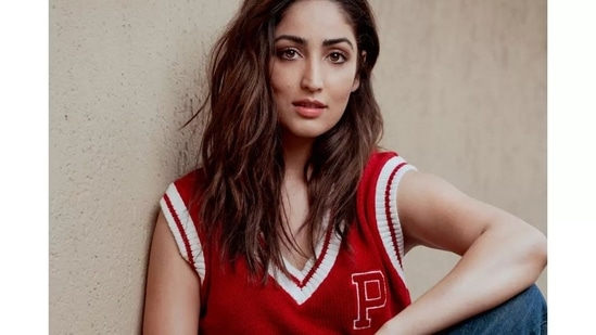 Yami Gautam Nude Sex - Yami Gautam gives sweater weather a sexy spin in red cut sleeves pullover,  jeans | Hindustan Times