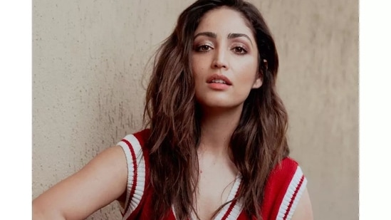 Valentine's Day is just around the corner and if you don't want to go the ideal date way - all elegant and fancy, take fashion inspiration from Bollywood actor Yami Gautam to slay a low-key and chill look in a red cut sleeves pullover with a pair of blue denim jeans. (Instagram/yamigautam)
